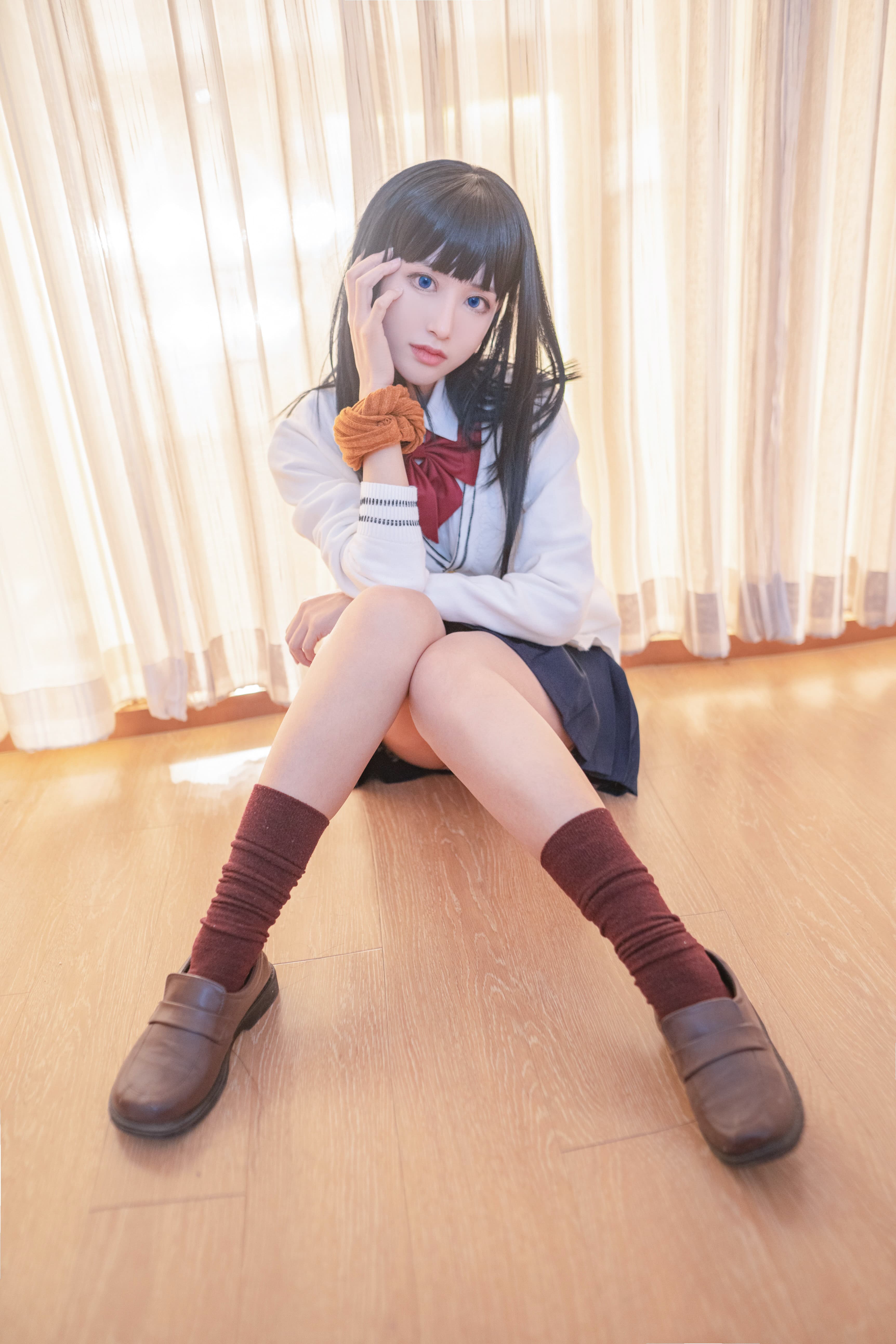 Casual arrangement of cotton socks and bare feet on soft fabric, suggesting worn comfort and intimate, tactile moments.